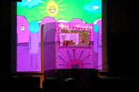 Dreams and 
    Delirium puppet show with animated background